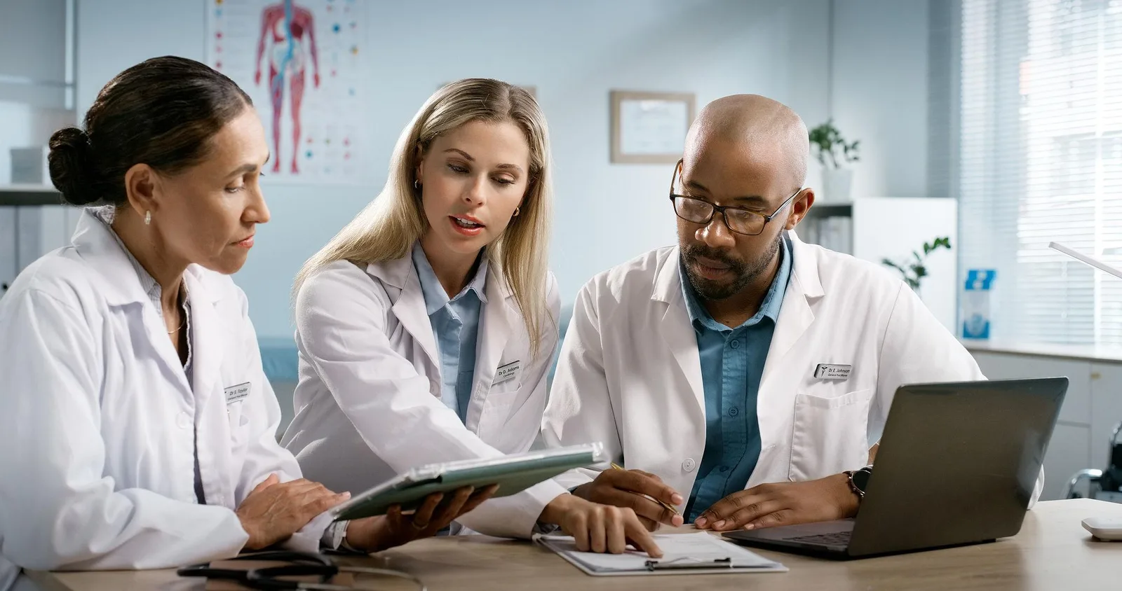 Editorial team reviewing clinical coverage in a newsroom-style setting