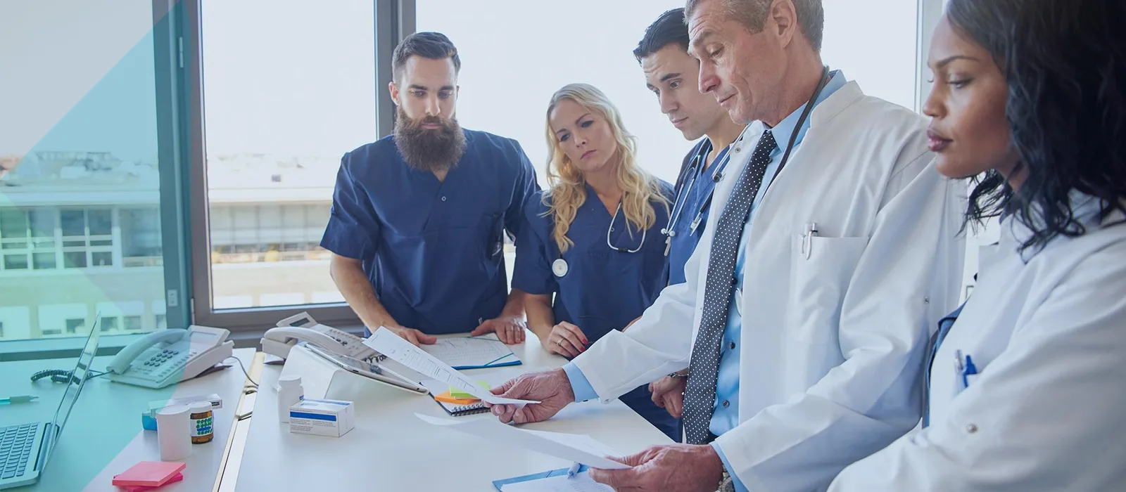 Healthcare professionals reviewing medical information